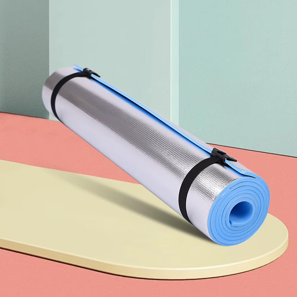 Roll of blue and white yoga mat on a colorful geometric background