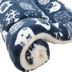 Blue blanket with white animal pattern on a white background