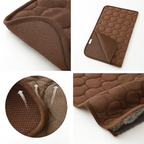 Brown quilted mat with textured surface and folded design on a white background