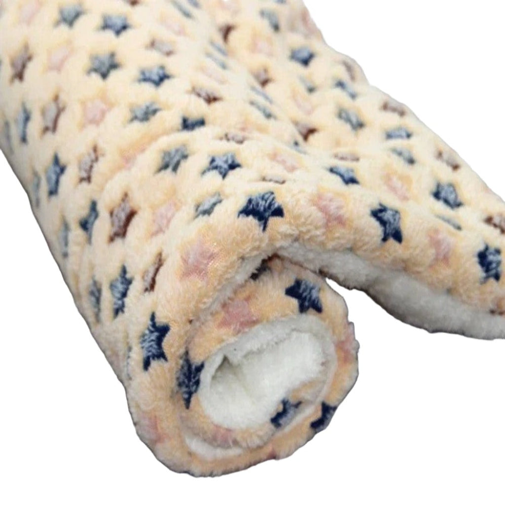 Roll of fleece fabric with star pattern on a white background