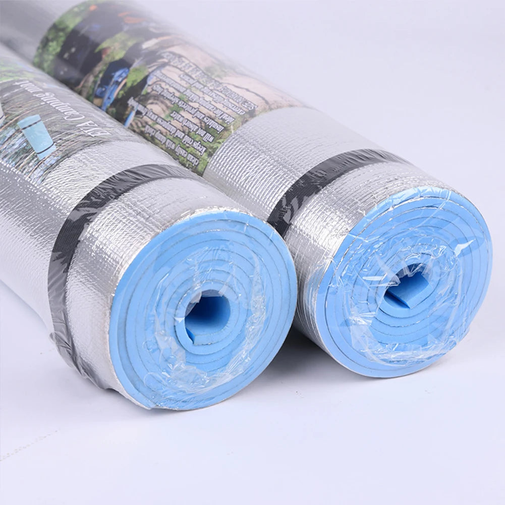 Two rolls of reflective insulation material on a white background