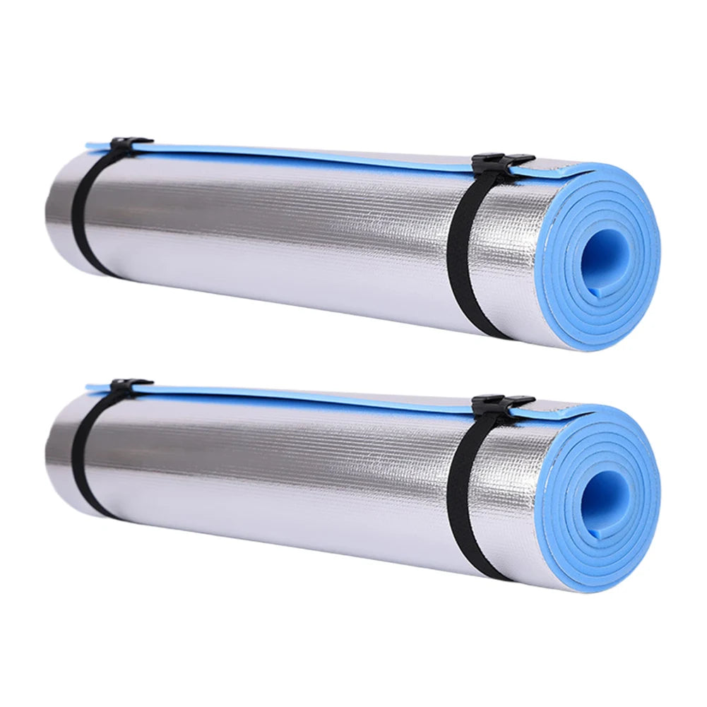 Two rolls of reflective insulation material with blue edges on a white background