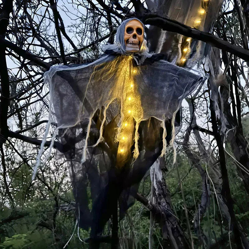 Halloween decoration of a ghostly figure with lights in a forest setting