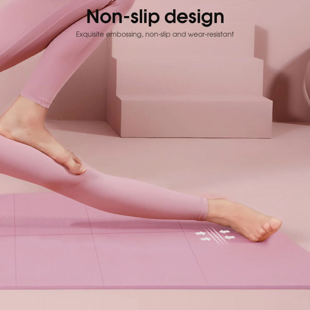 Person wearing pink leggings on a pink mat with 'Non-slip design' text.