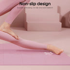 Person wearing pink leggings on a pink mat with 'Non-slip design' text.