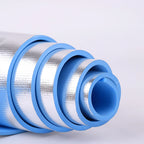 Rolls of silver insulation material with blue edges on a white background