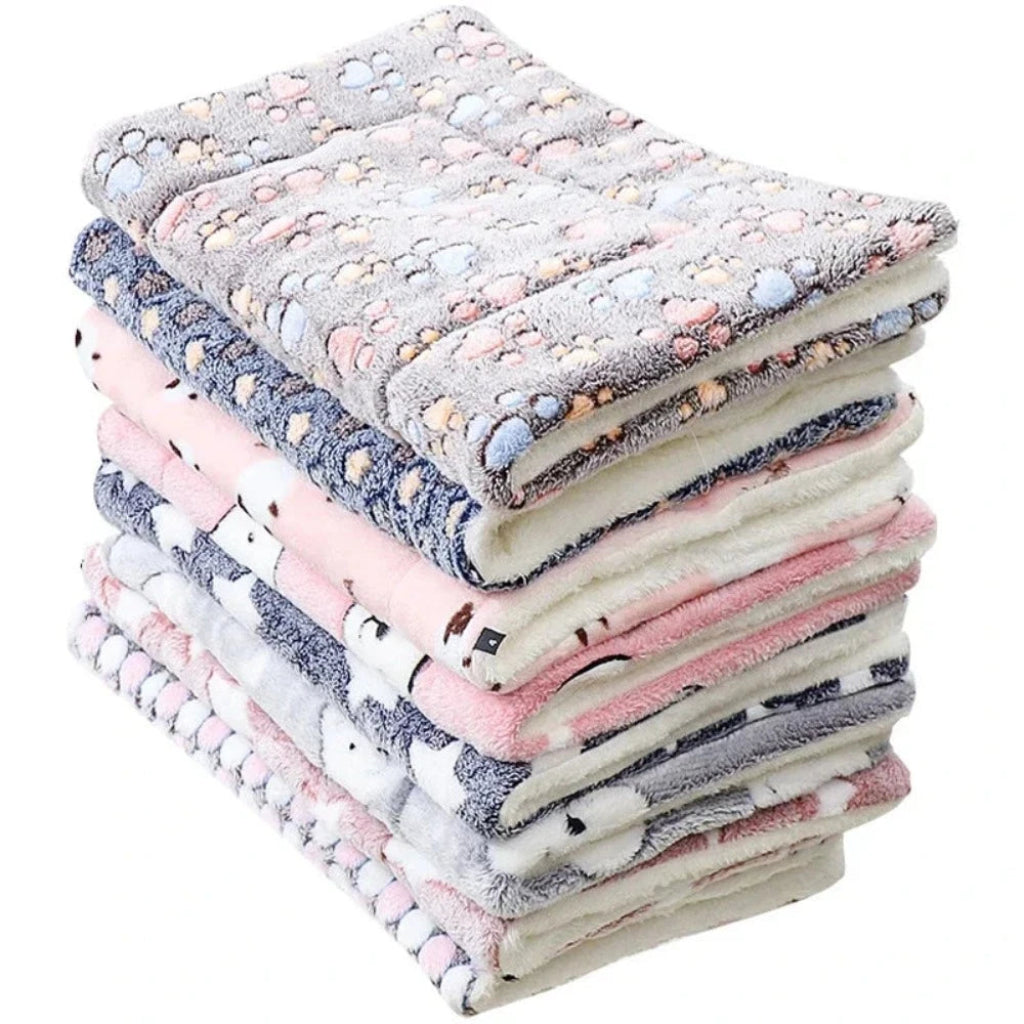 Stack of soft, patterned mat on a white background
