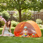 Baby beach tent set up in sunny backyard
