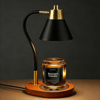 Black metal top-down candle warmer lamp on a wooden base