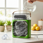 Green portable air cooler fan being filled with ice cubes