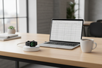 Apple Watch charger being used on modern office desk with laptop