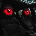 Red devil's eye headrest covers on both front seats at night